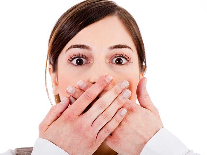A girl covering her mouth