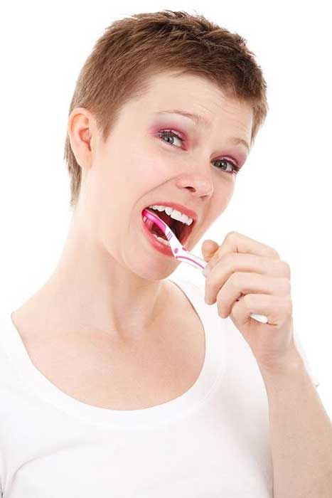 A girl brushing her teeth