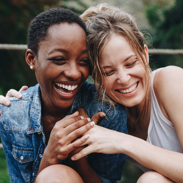 two female friends hugging